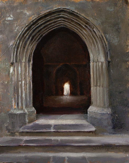 View through an open doorway of a distant doorway flooded with light at the Rock of Cashel Cathedral, Cashel, Ireland