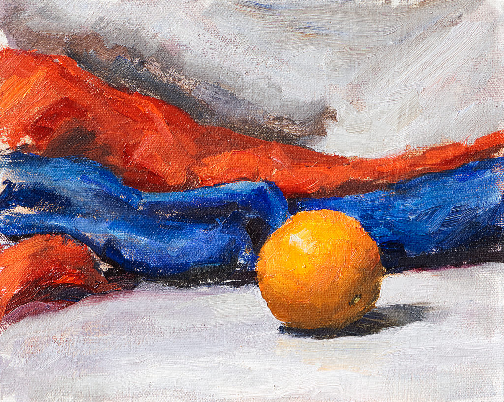 Still life oil painting of an orange on a white fabric with red and blue background fabrics. Created as a demonstration for the oil painting instructional video ‘Fundamentals of Painting’. Orange, Red, Grey and Blue, Original oil on canvas, 8" x 10" Framed prints and canvases, digital download, commercial and advertising licensing of photographs by Seamus Berkeley.