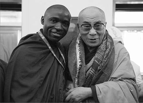 Photograph of Steven Kaboggoza with His Holiness the Dalai Lama in India.